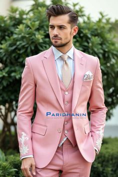 a man wearing a pink suit and tie