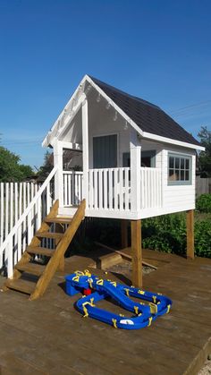 there is a lifeguard house on the deck with an inflatable raft attached to it