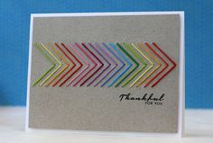 a thank you card with an arrow made out of colored pencils on top of it