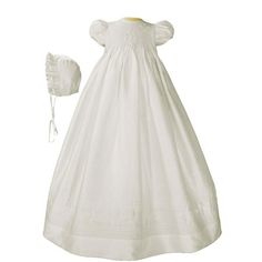 Beautifully smocked silk dupioni (slightly off white) 32 gown with hand embroidery and pin tucking on bodice and skirt. Sash at back of gown and stretch in smocking enables gown to fit several size babies. Includes matching bonnet and attached slip. Handmade in South America. 100% Silk. (Please note that all natural silk fabrics have slubs which are an inherent part of the fibers and add to the individuality of the set. These should not be mistaken for flaws in the fabric.) Dry clean. Shipped wi Baptism Gown, Cotton Gowns, Silk Dupioni, Vinyl Bag, Long Term Storage, Christening Outfit, Christening Dress, Silk Fabrics, Natural Silk