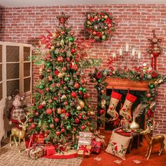 a decorated christmas tree sitting next to a fireplace