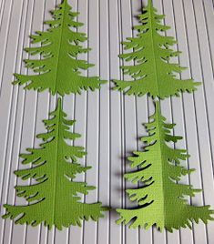 green paper cut out to look like trees