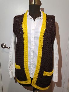 Retro 1970s Crochet Brown and Yellow Vest With Pockets A very popular color from the greatest decade, the 1970s! Brown and Yellow yarn used to create this retro Crochet vest which is perfect for fall weather and winter weather. A nostalgic piece of vintage fashion! Everyone was wearing Crochet vest back in the day!  The vest measures: Breast 38"  Waist 38" Hips 40" Length 30"  A very Nicely Done Crochet hippie mod style vest. Some pilling but really a nice vintage Crochet 70s vest to keep you wa Vintage Crochet Vest, Fitted Retro Brown Sweater Vest, Crochet Vest Brown, 70s Vest Crochet, Fitted Brown Vintage Sweater Vest, Men's Vest, 1970's Fashion, Yellow Vest, Women's Vest