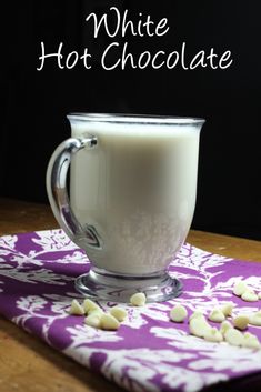 white hot chocolate in a glass mug with marshmallows