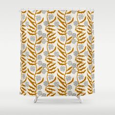 an orange and white shower curtain with leaves on it