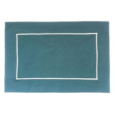 a blue rug with a white border on the bottom and an empty square in the middle