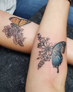 two women with tattoos on their arms and one has a butterfly tattoo on her arm