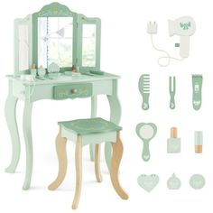 a doll's dressing table with mirror and accessories