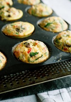 muffins with various toppings in a baking tray