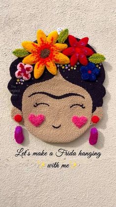 a frida hanging with flowers on it's head and the words let's make a frida hanging with me