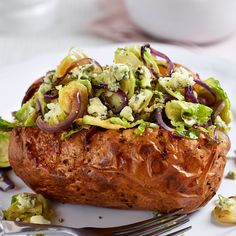 a close up of a baked potato on a plate