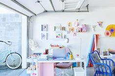 a room filled with furniture and lots of clutter on the floor next to a bike