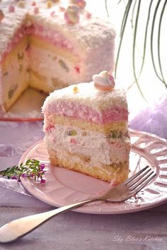 a piece of cake on a plate with a fork next to it and another slice in the background