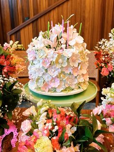 there is a cake with flowers on the table