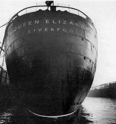 an old photo of a large ship in the water with writing on it's side