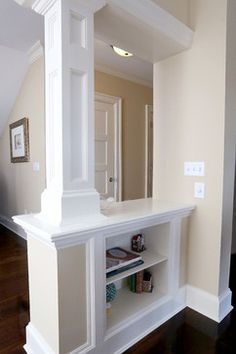 an image of a white shelf in the middle of a room