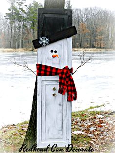 a snowman made out of an old door