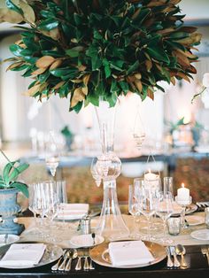 a table set with place settings and candles