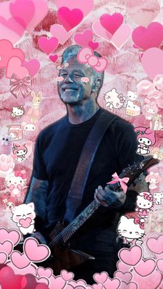 a man holding a guitar in front of pink hearts with hello kitty stickers on it