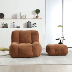 a living room scene with focus on the chair and ottoman