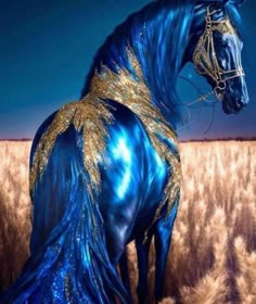 a blue and gold horse standing in the middle of a wheat field with its tail curled up