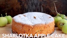 an apple cake is being sprinkled with sugar