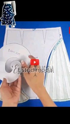 someone is making a skirt out of paper