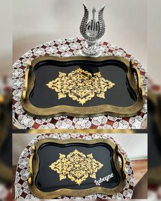 two black and gold trays with ornate designs