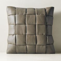 a pillow made out of leather squares