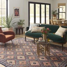 a living room filled with furniture and lots of windows