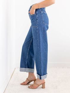 We are loving the denim updates that we are seeing this season and these new arrivals from Free People show off some of our favorite details all in one. The unique button waist detail adds a unique and casual twist on a traditional waistband. A wider leg silhouette features a cuffed accent that can be uncuffed for versatility, allowing this look to be styled in a variety of ways this season. Free People Wider leg silhouette Cuffed hemline Unique button waist accent 100% Cotton Rise: 10.5" Inseam: 26" cuffed | 31" uncuffed.. Leg opening: 17" Trendy Jeans For Spring Casual Gatherings, Spring Utility Jeans For Everyday, Trendy Spring Jeans For Casual Gatherings, Trendy Fall Jeans For Casual Gatherings, Dark Wash Bottoms For Everyday Fall Wear, Relaxed Fit Denim Blue Flare Jeans For Work, High Rise Cargo Jeans For Everyday Spring Wear, Spring Everyday Cargo Jeans With Patch Pockets, Spring Everyday Cropped Jeans In Dark Wash