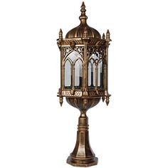 an old fashioned brass lantern on a white background