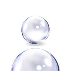 two glass balls on a white background, one is clear and the other is shiny