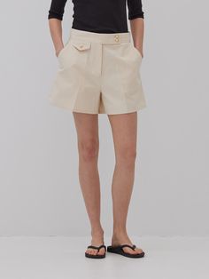 This is a feminine and modern pants by MangoManyPlease that is made out of high quality and sturdy material. With distinctive mood of the design and comfortable wear, you can style it for your feminine daily outfit.- Relaxed A line silhouette- Subtle gold button on high density fabric- Trendy and feminine mood Elegant Shorts With Buttons, Elegant Wide Leg Beige Shorts, Elegant High-waisted Shorts With Pockets, Elegant High-waisted Shorts With Button Closure, Elegant High Waist Shorts With Button Closure, Elegant Short Bottoms With Button Closure, Chic High-waisted Shorts With Button Closure, Elegant Short Bottoms With Buttons, Elegant Bottoms With Short Legs And Belt Loops