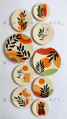 six plates with different designs on them