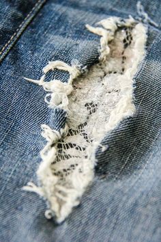 the ripped jeans with holes in it are shown