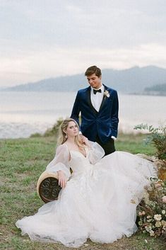 a man in a tuxedo standing next to a woman in a wedding dress