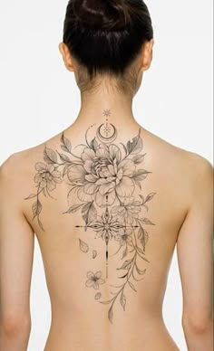 the back of a woman's body with flowers on it