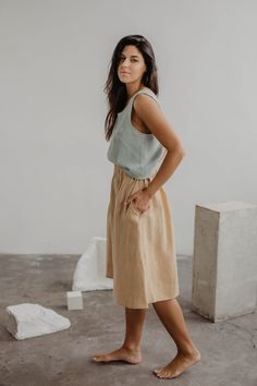 A beautiful and comfortable midi length linen skirt with buttons DAISY. Comes with pockets on the side seam-line at the hips and seashell buttons at the front, with an elastic waistband. Great for many different styles and occasions, pair it with high heels for a dinner party or sneakers for a day in the city. ABOUT DAISY linen skirt with buttons Model Agnė is 177cm/5'8" and wearing mustard DAISY in size M Model Emile is 173cm/5'6" and wearing charcoal DAISY in size M Available in sizes XS, S, M Long Linen Pants, Color Checker, Ethical Clothing Brands, Long Linen Dress, Skirt With Buttons, Ethical Clothing, Linen Skirt, Linen Top, Handmade Knitting