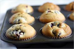 blueberry muffins in a muffin tin ready to be eaten