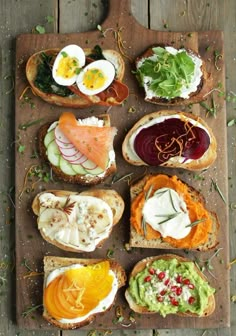 several different types of food are on a cutting board, including breads and eggs