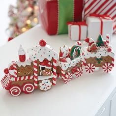 a group of gingerbread christmas train figurines sitting on top of a table