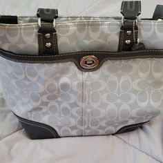 Gray Coach Shoulder Purse. The Purse Has Been Used But Has Original Tag. The Purse Has Several Great Pockets. One Pocket In The Front With A Silver Twist Clasp. There Is A Slip In Pocket On The Back. There Is A Zipper On The Top As Well. On The Inside There Are Sveral.Slip.In Pockets For Phones Or Cards. Bags Coach, Coach Purse, Shoulder Purse, Coach Purses, Coach Bags, Diaper Bag, Gray Color, Bag Lady, Slip On