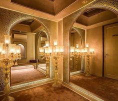 an elaborately decorated bathroom with chandeliers and mirrors