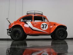 an orange and white car with number 37 on it