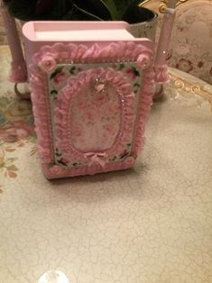 a small pink box sitting on top of a table