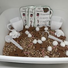 a bowl filled with coffee beans and marshmallows