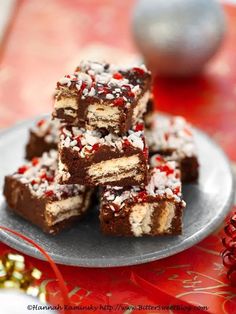 some brownies are stacked on top of each other with sprinkles around them