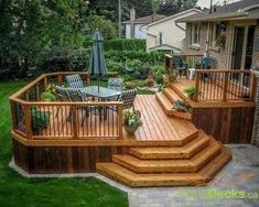 a wooden deck with chairs and an umbrella