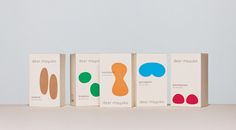 three boxes with different designs on them sitting next to each other in front of a white background